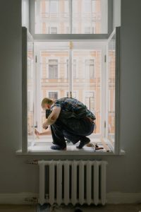 Reactive maintenance-showing man repairing window